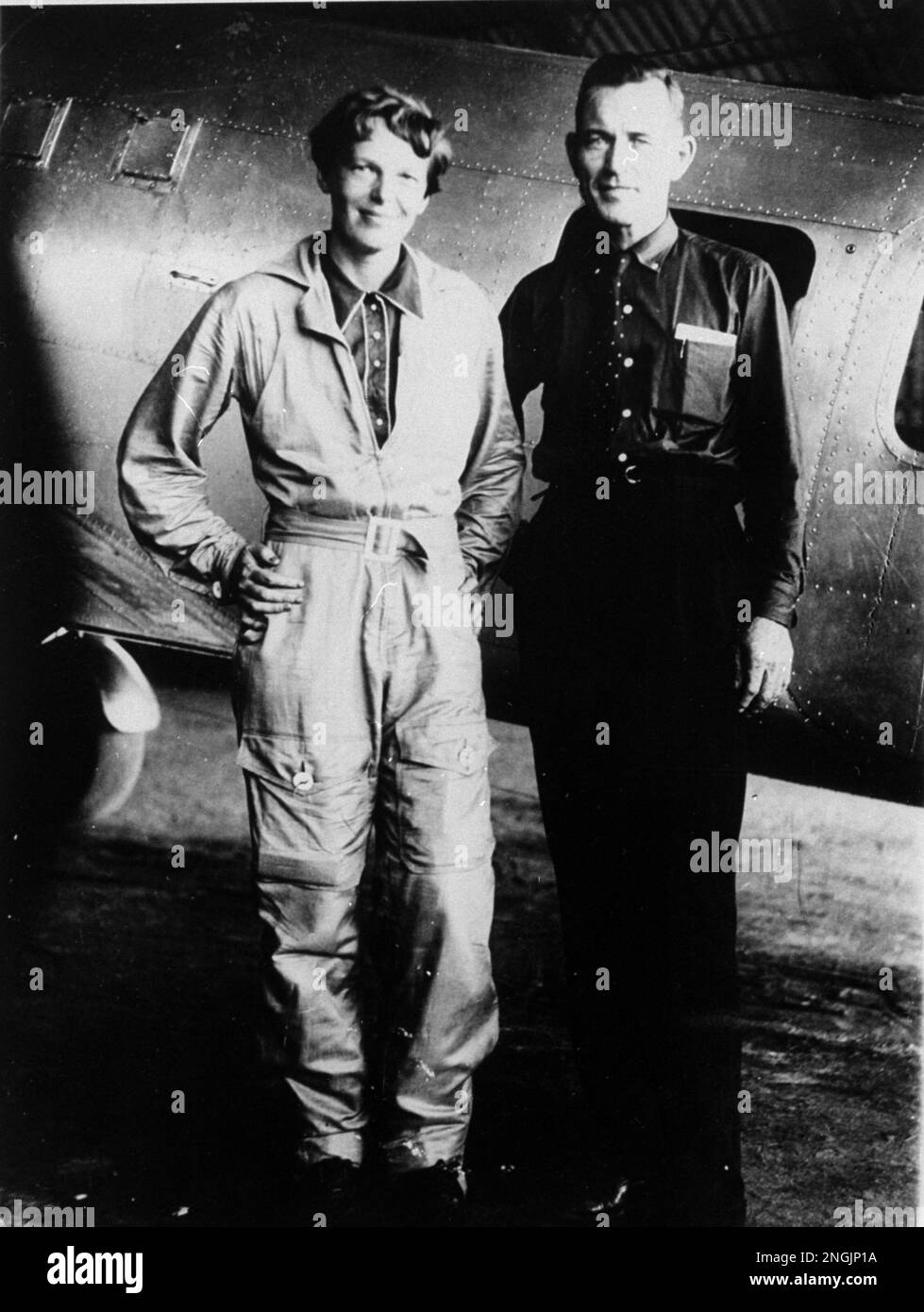 Famed aviatrix Amelia Earhart and her navigator, Fred Noonan, pose in