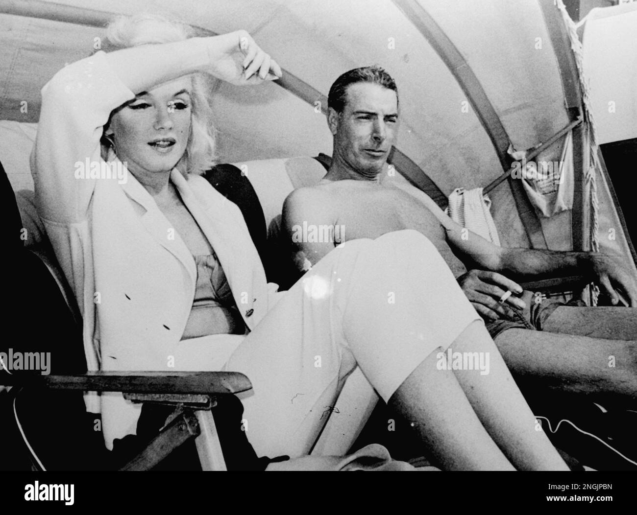 Marilyn Monroe and Joe DiMaggio traveling to Florida, March 1961.