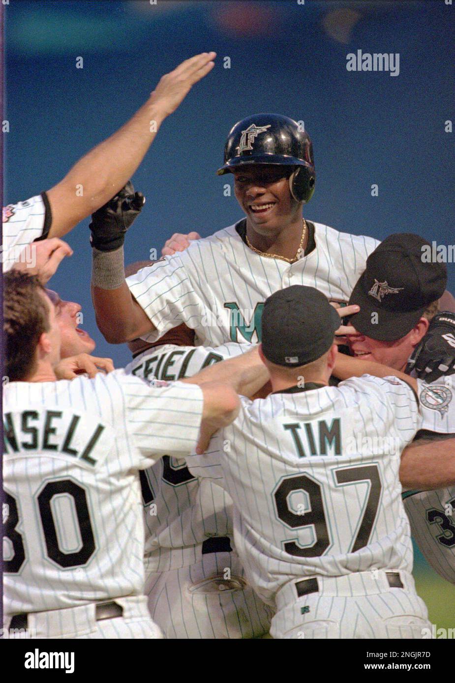 Florida Marlins shortstop Edgar Renteria, top, gets a lift from