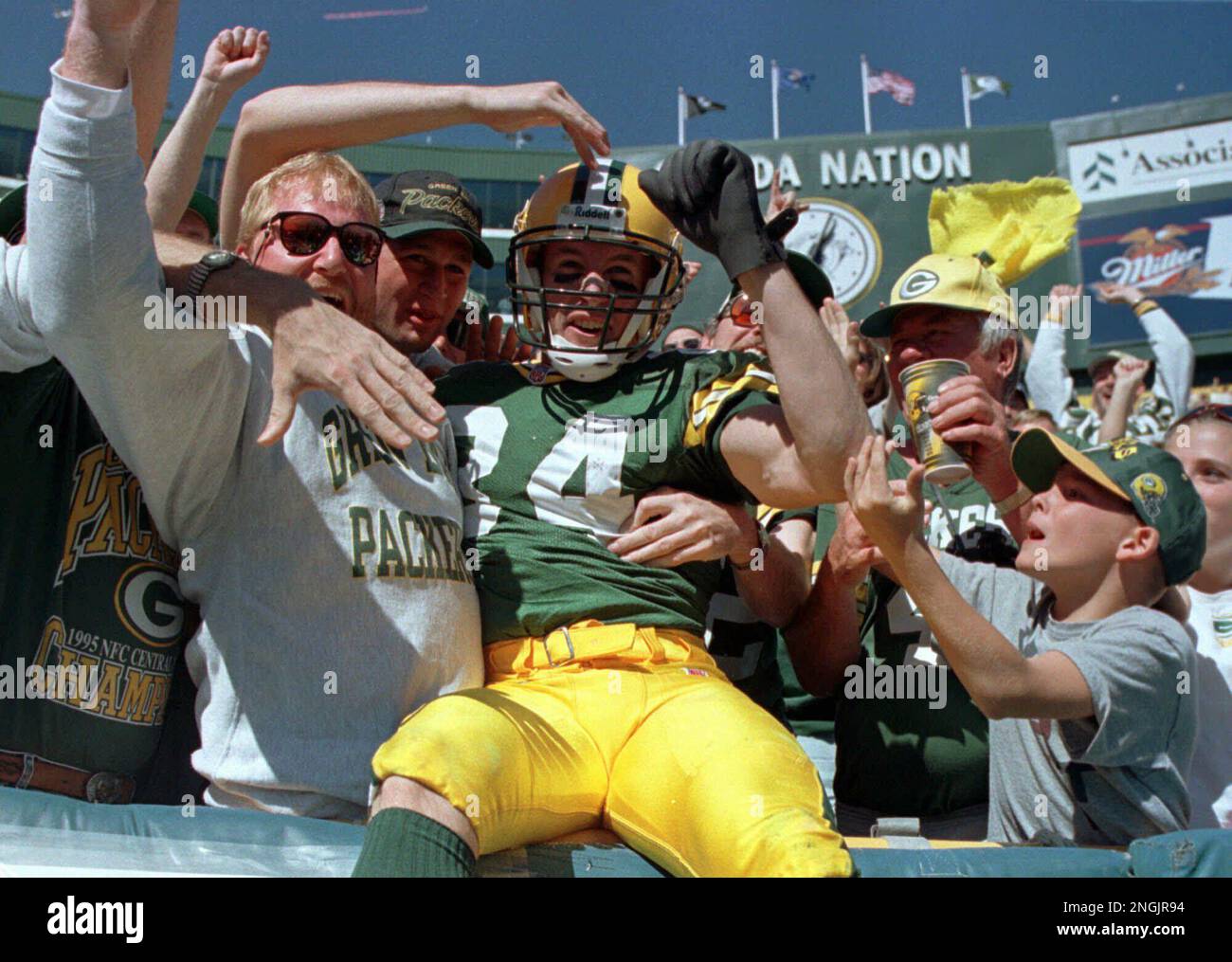 Green Bay Packers receiver Bill Schroeder jumps into the crowd after