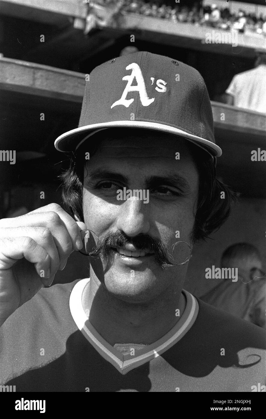 Oakland A's relief pitcher Rollie Fingers fingers his handlebar mustache in  Oakland, California, Saturday, October 15, 1973. Many of his teammates  boast facial foliage, but none compares with Fingers' finely waxed lip