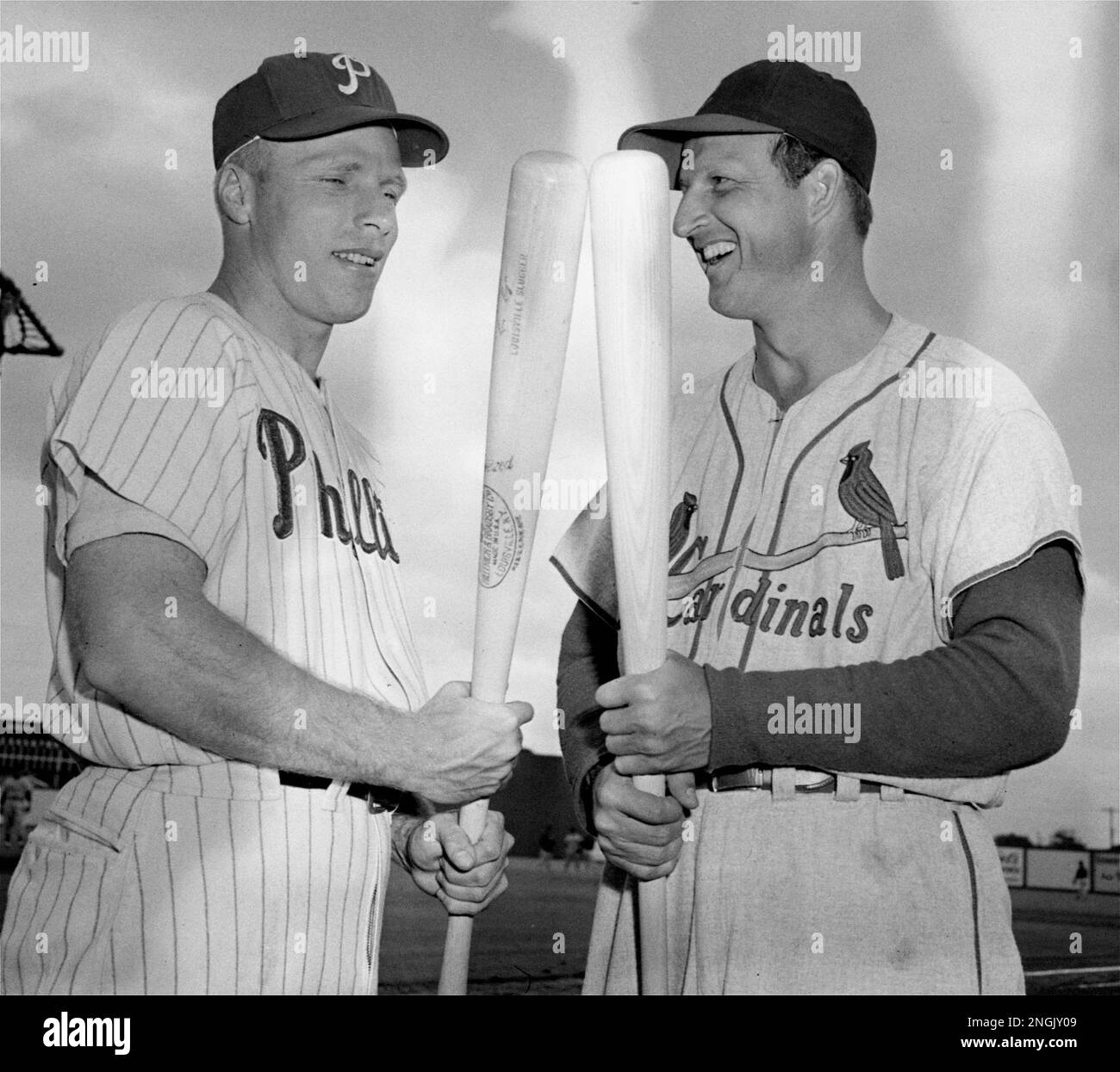 The 1955 National League batting champion Richie Ashburn of the  Philadelphia Phillies, left, and the ex-champion Stan Musial of the St.  Louis Cardinals, greet each other before an exhibition game in Clearwater