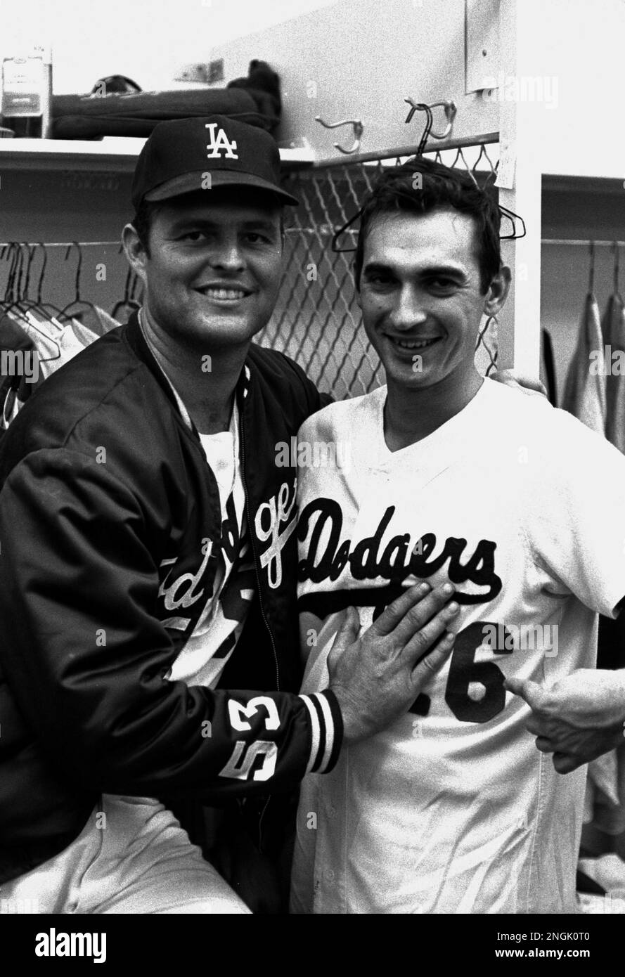 Los Angeles Dodgers' pitcher Don Drysdale with infielder Paul Popovich,  right, after Drysdale set new major league record by pitching sixth shutout  in a row and National League record of 54 consecutive