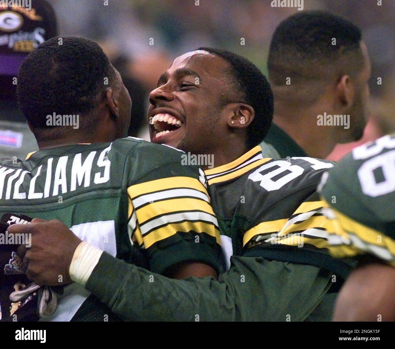 Green Bay Packers' Desmond Howard hugs teammate Tyrone Williams