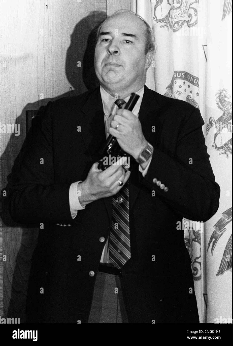 Pennsylvania state Treasurer R. Budd Dwyer holds a pistol in his hand