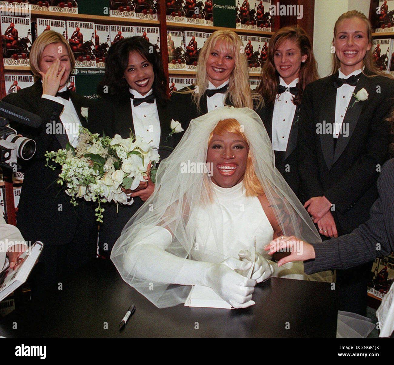 FILE--Chicago Bulls forward Dennis Rodman, dressed as a bride, poses for  photographers at a New York bookstore Wednesday, Aug. 21, 1996, while  promoting his book, "Bad As I Wanna Be." Rodman led