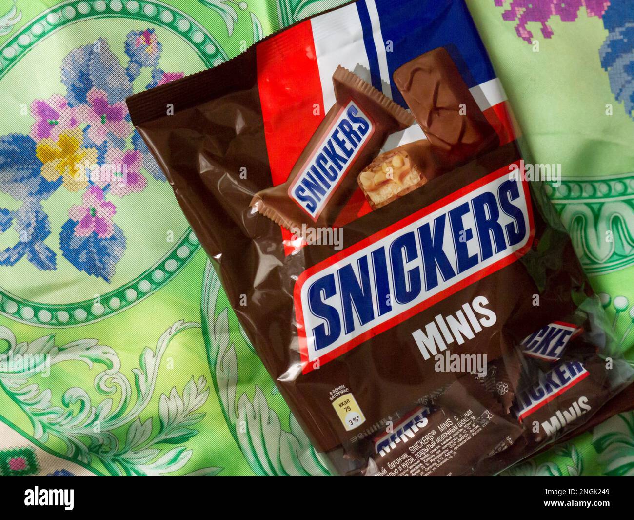 Сhocolate bar Snickers on a brown background. Stock Photo