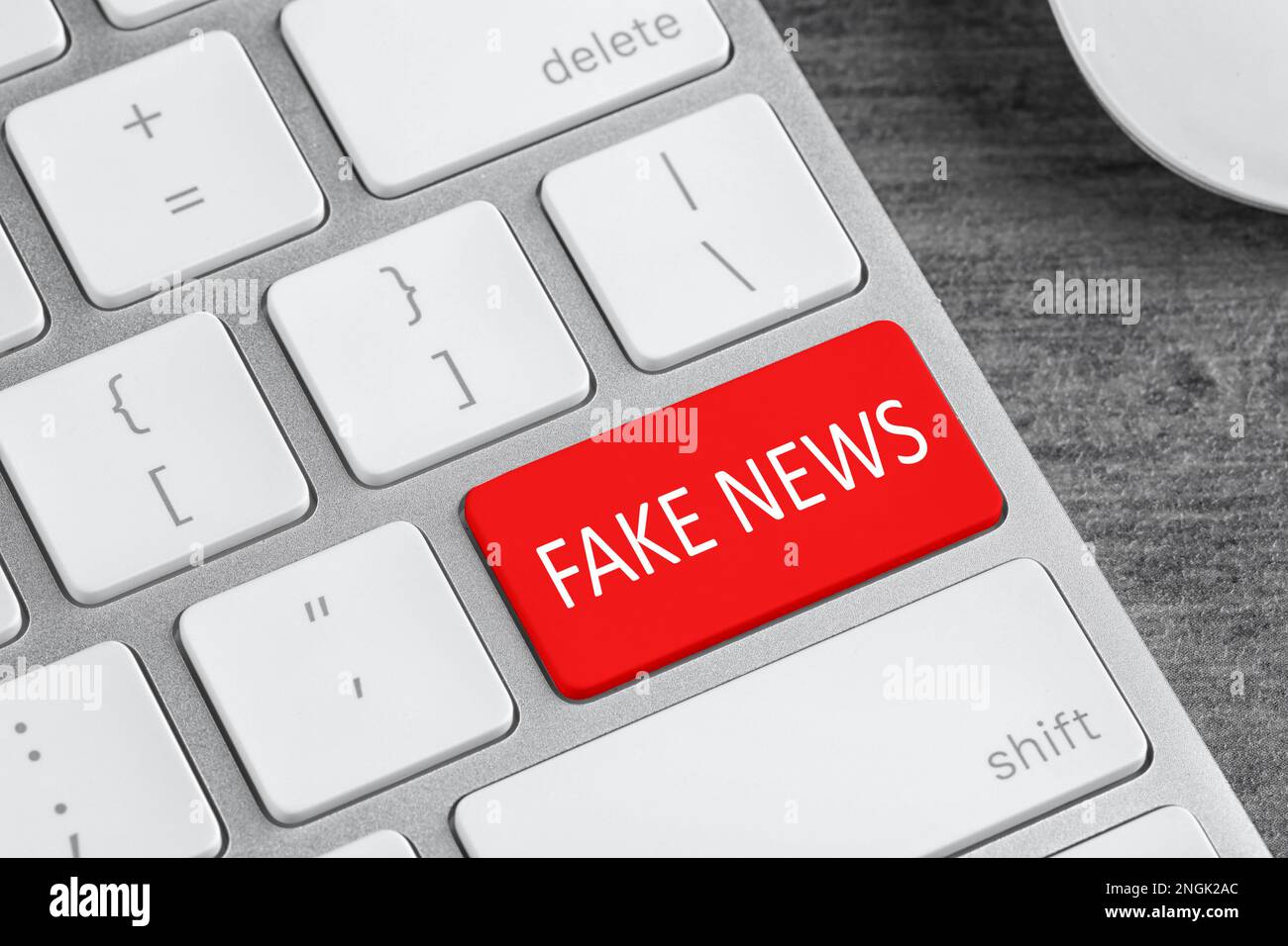 Modern computer keyboard with text FAKE NEWS on button, closeup Stock
