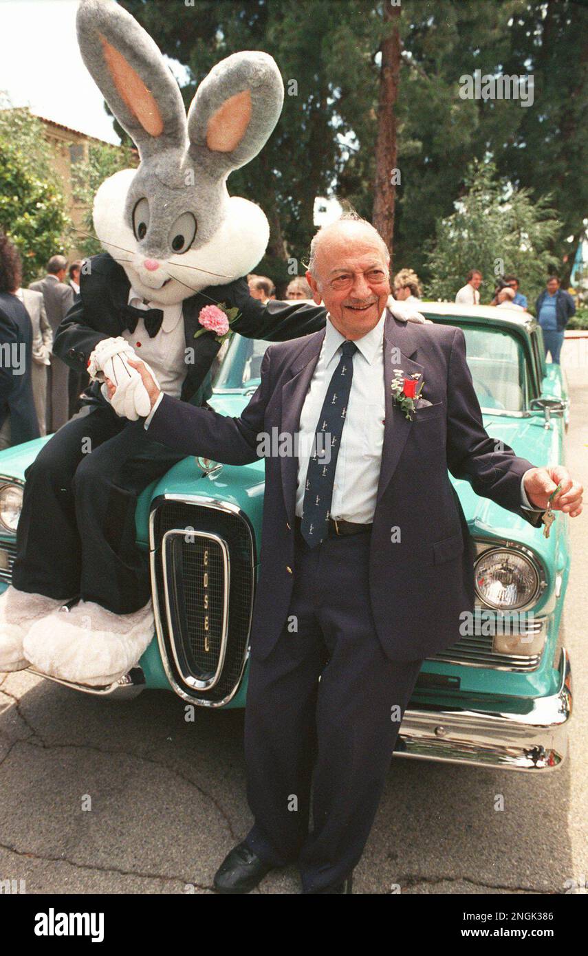 Mel Blanc poses with Bugs Bunny at his 80th birthday party in Los
