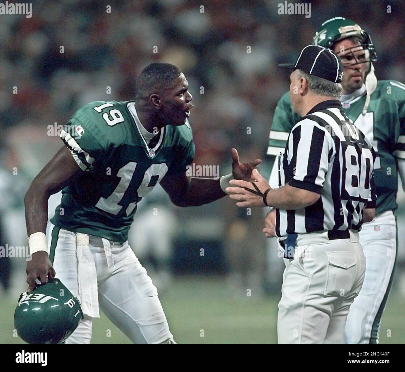 New York Jets' Keyshawn Johnson (19) gets hugged by teammates after scoring  a touchdown in the second quarter against the Indianapolis Colts Sunday,  Sept. 8, 1996, at Giants Stadium in East Rutherford