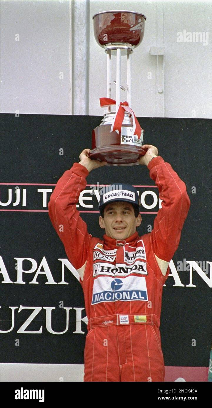 Ayrton Senna holds trophy aloft October 30, 1988 after he won the