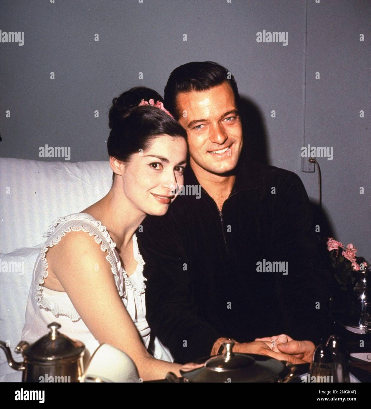 Robert Goulet and wife Carol Lawrence, seated on wife's hospital bed in