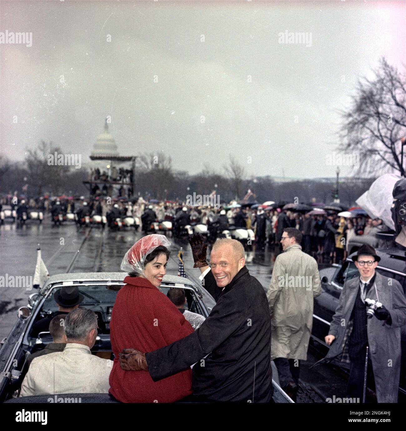 Mercury astronaut John Glenn, and his wife, Annie Glenn ride in the ...