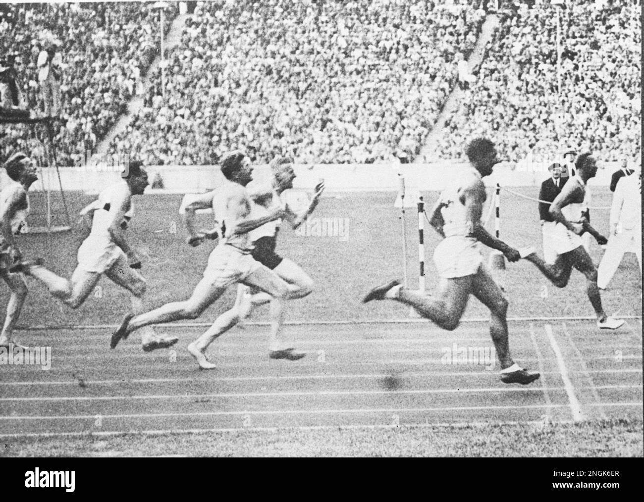 Jesse Owens is shown winning the 100meter dash at the 1936 Summer