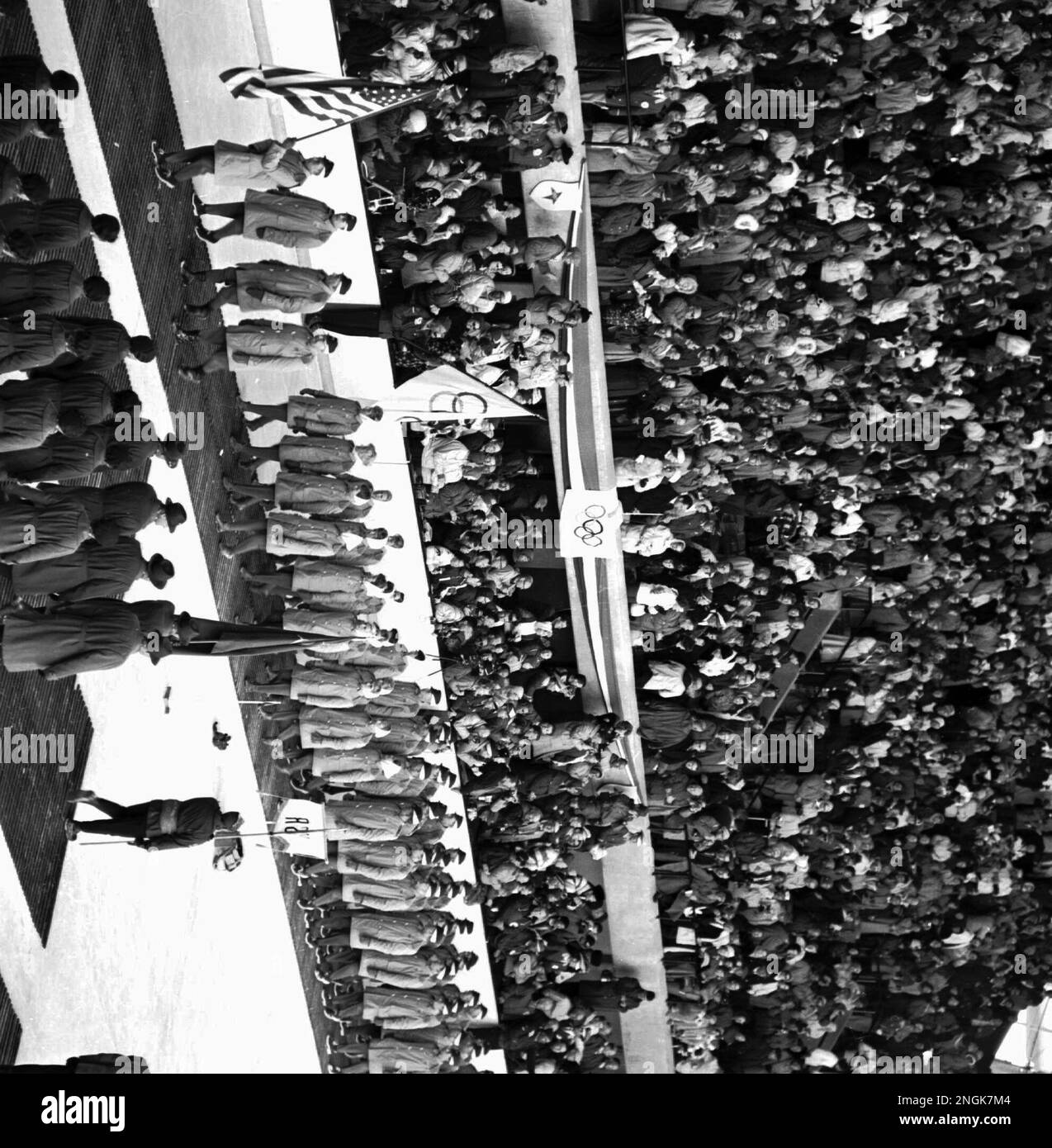 america-s-gray-coated-athletes-march-in-formation-past-vice-president