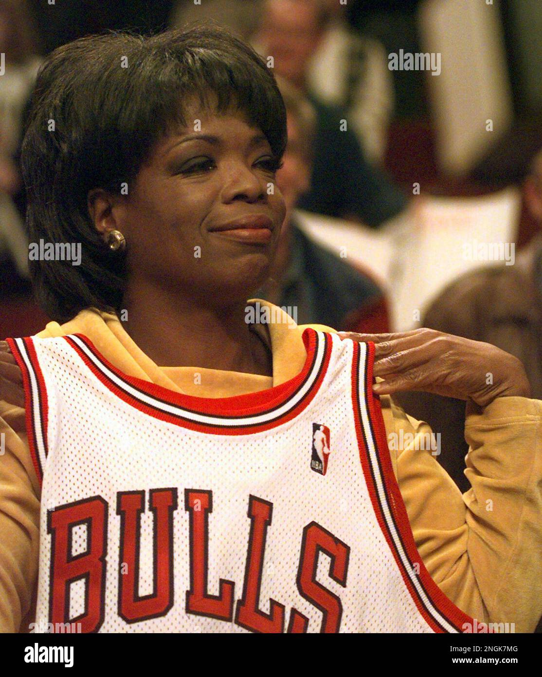 Oprah Winfrey shows off the Chicago Bulls jersey given to her by Dennis  Rodman after the playoff game with the New York Knicks Tuesday, May 7,  1996, in Chicago. The Bulls beat