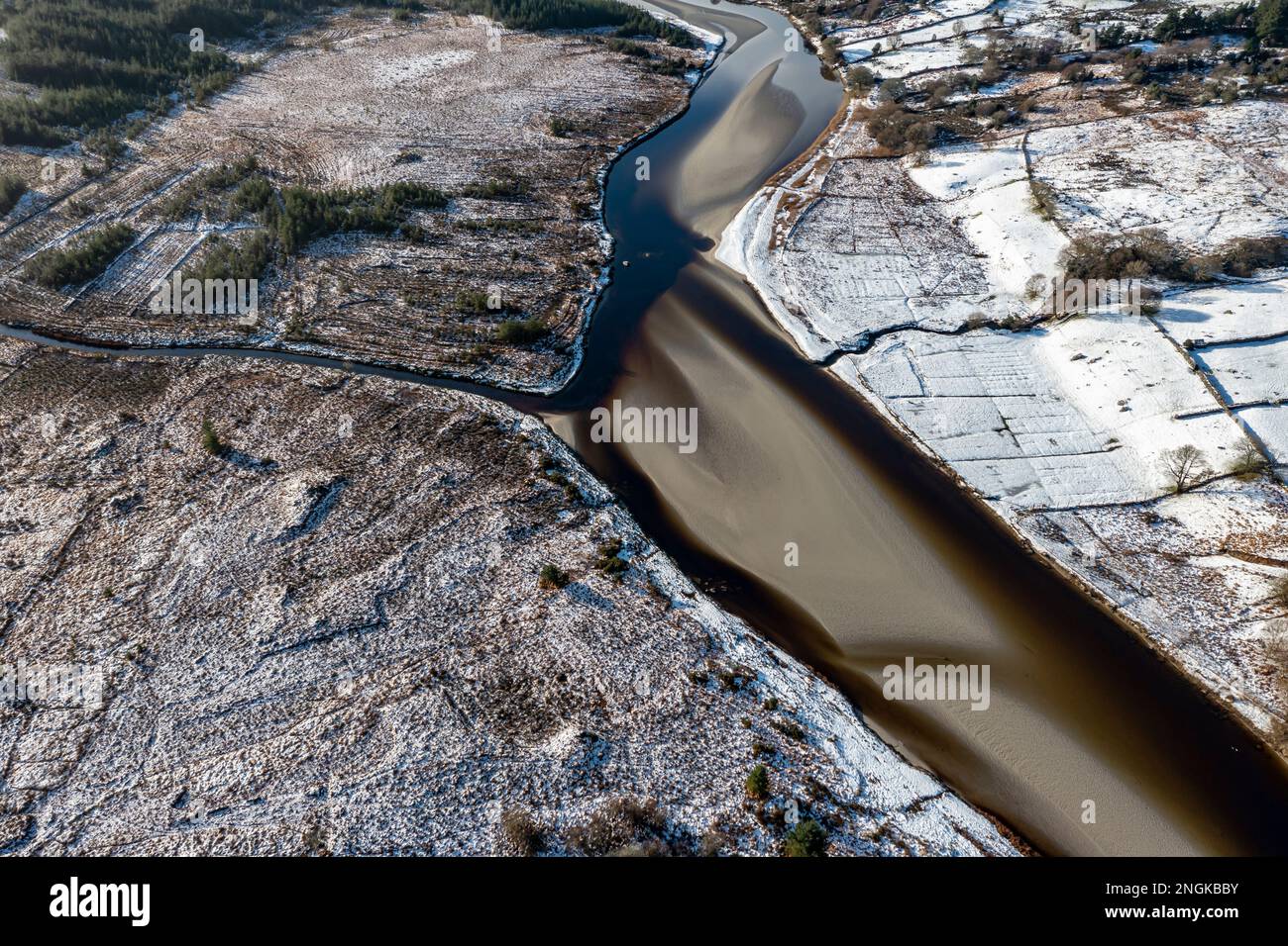 Aerial view of snow covered Gweebarra River between Doochary and ...