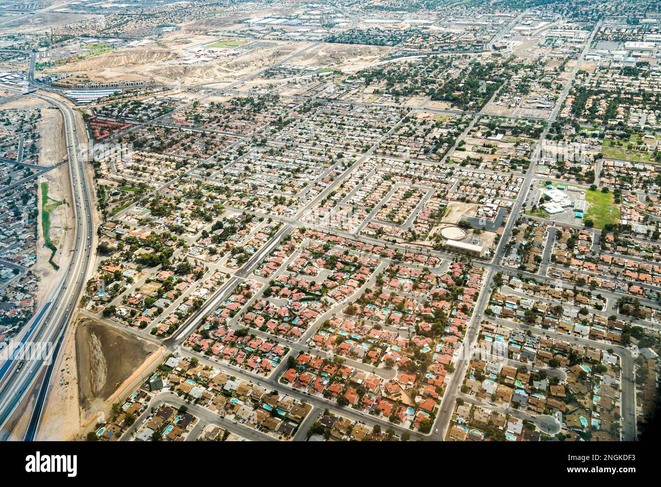 Aerial view of a geometric housing complex with bungalows. This suburban residential housing complex is in a geometrical form. Stock Photo