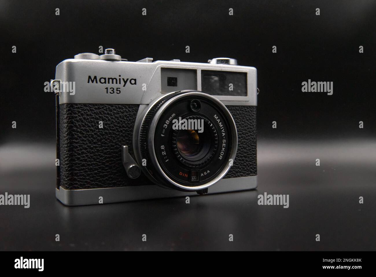 Closeup shot of Mamiya 135 EE rangefinder camera with Mamiya Sekkor 38mm lens on black background Stock Photo