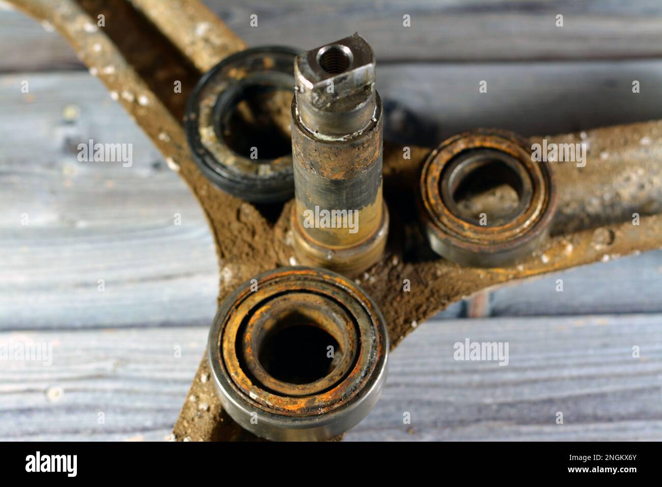 Rusty old dirty automatic electric washing machine drum spider and ball