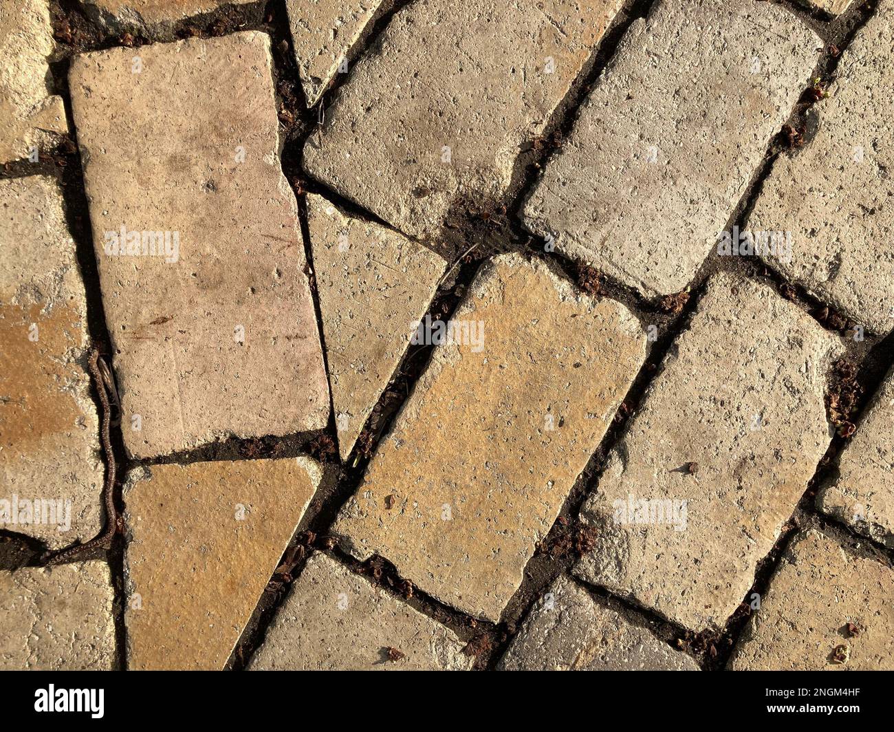 Yellow stone tiles masonry closeup background. the texture of yellow