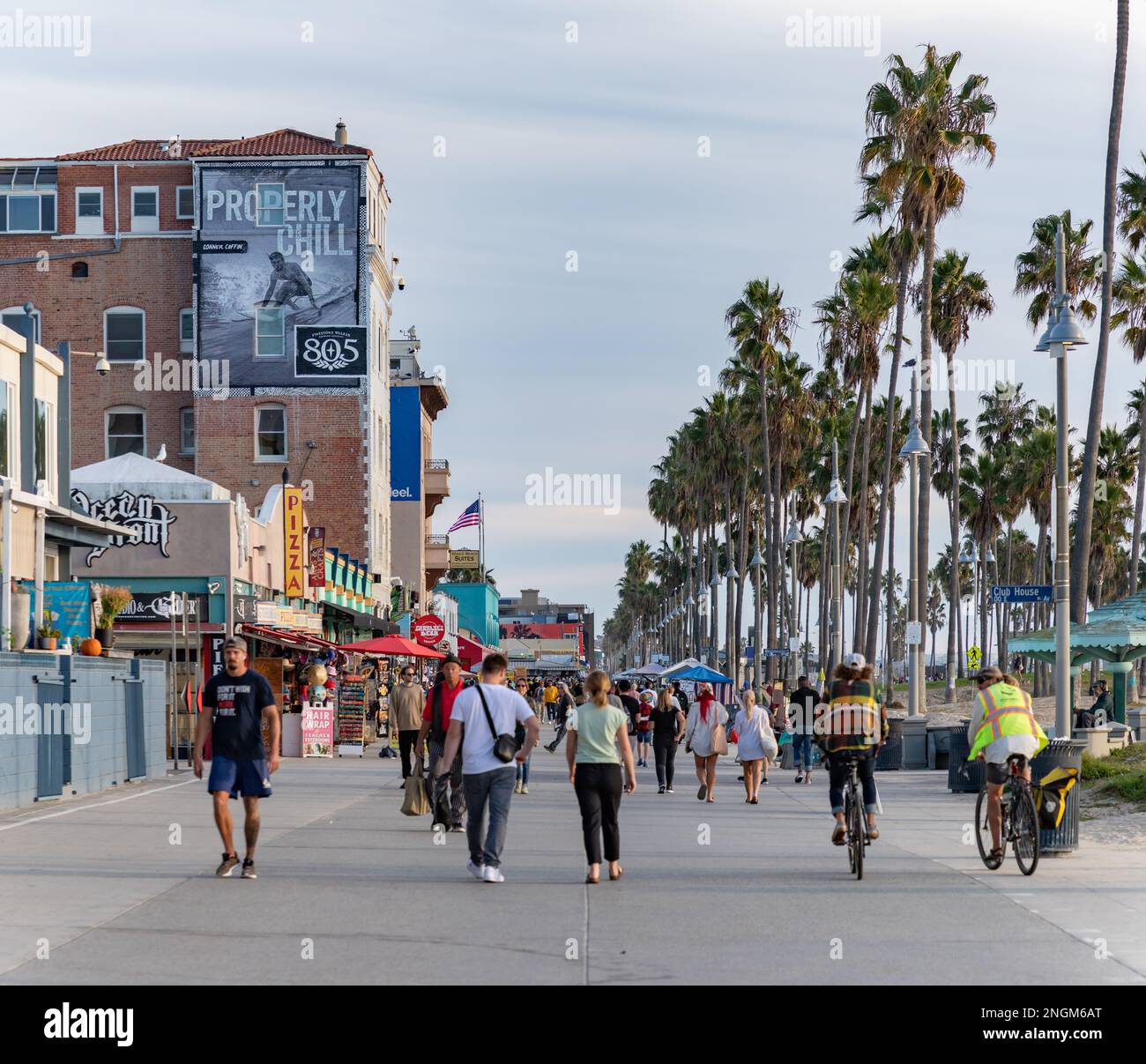 A picture of the iconic Venice Beach boardwalk with people walking on ...