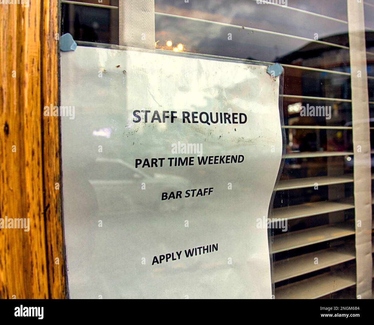 Bar staff required notice in window Stock Photo