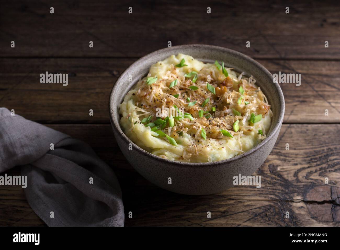Traditional Irish dish colcannon, mashed potatoes with cabbage and green onions, on top of