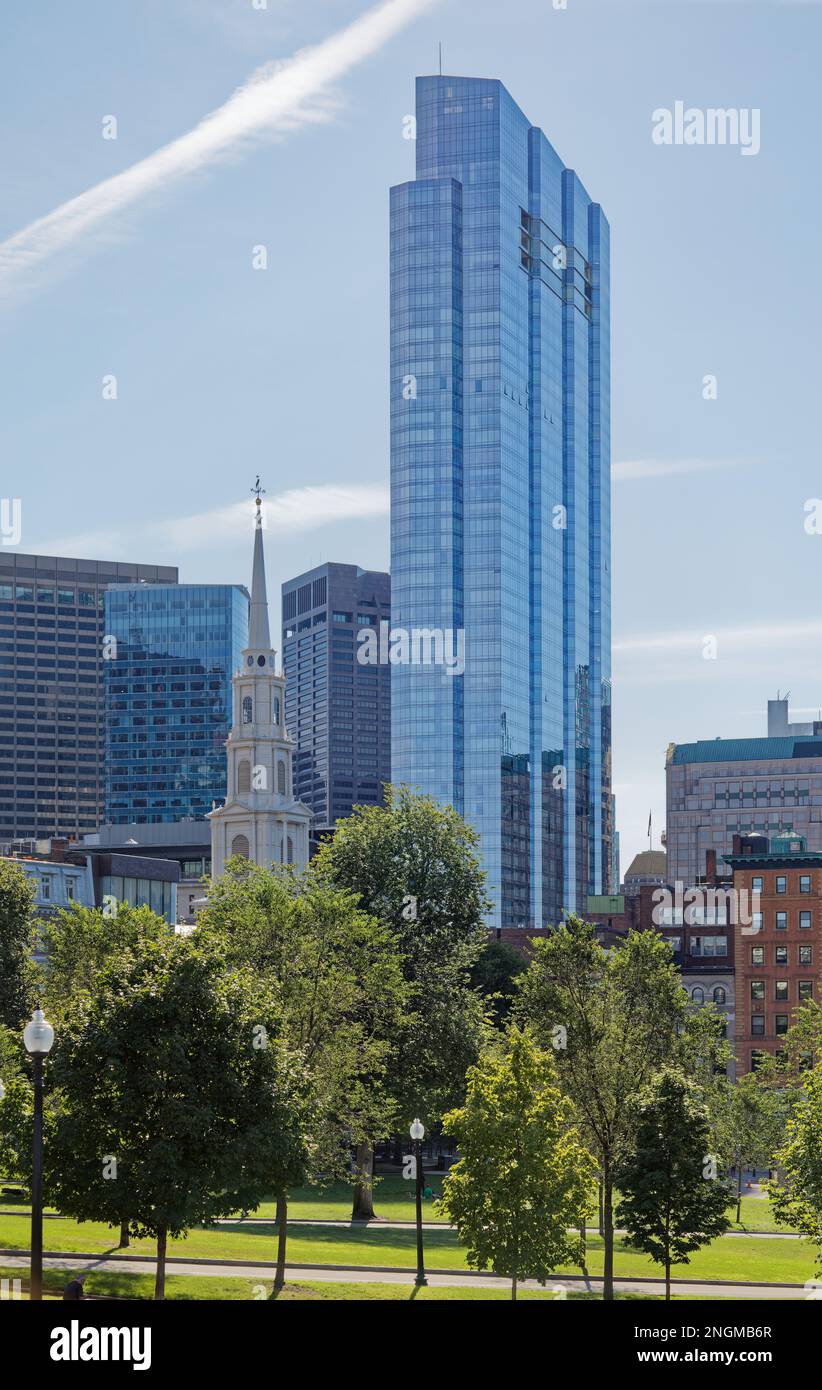 Millennium Tower, a residential skyscraper in Boston’s Downtown Crossing neighborhood, viewed from Boston Common. Park Street Church is at left. Stock Photo