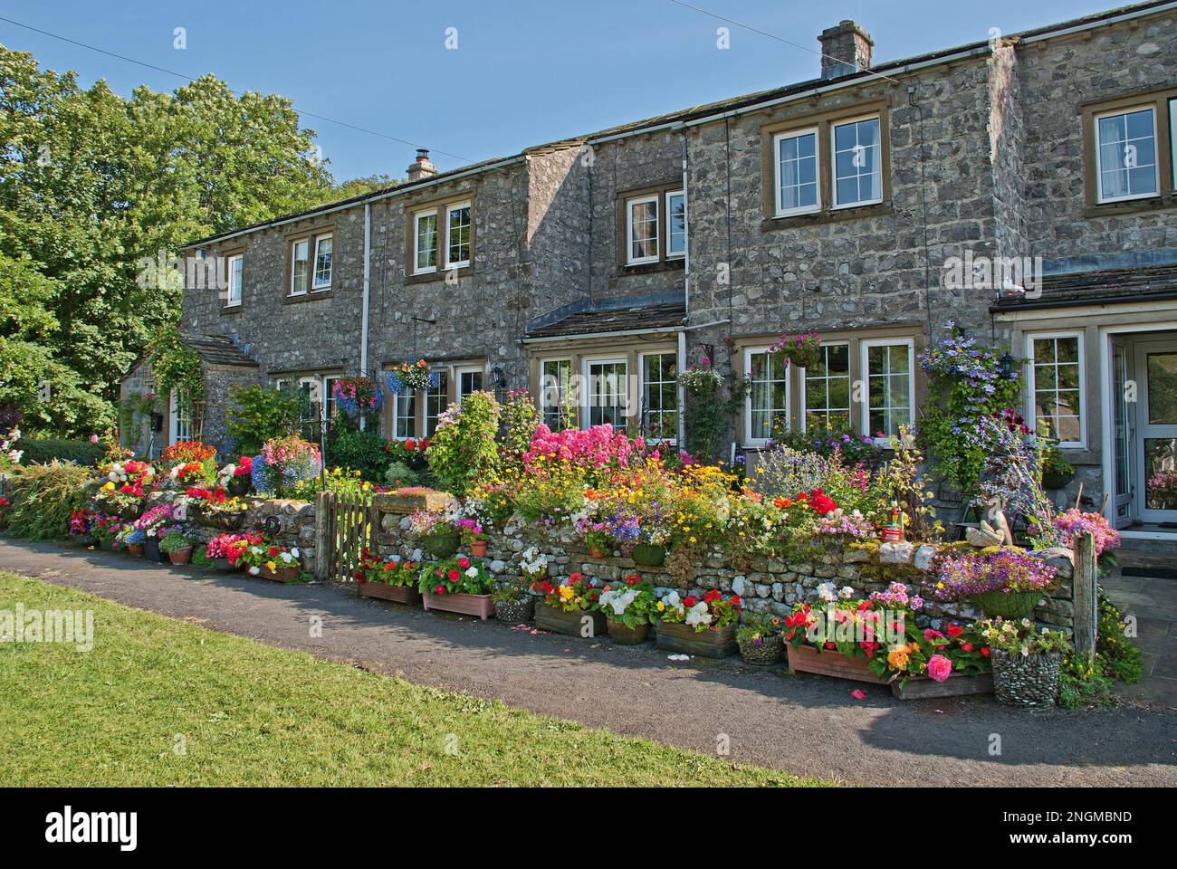 An amazing display  of flowers at Langcliffe Garth, Kettlewel,Yorkshire Dales seems to coincide well with the annual Scarecrow Festival. Stock Photo