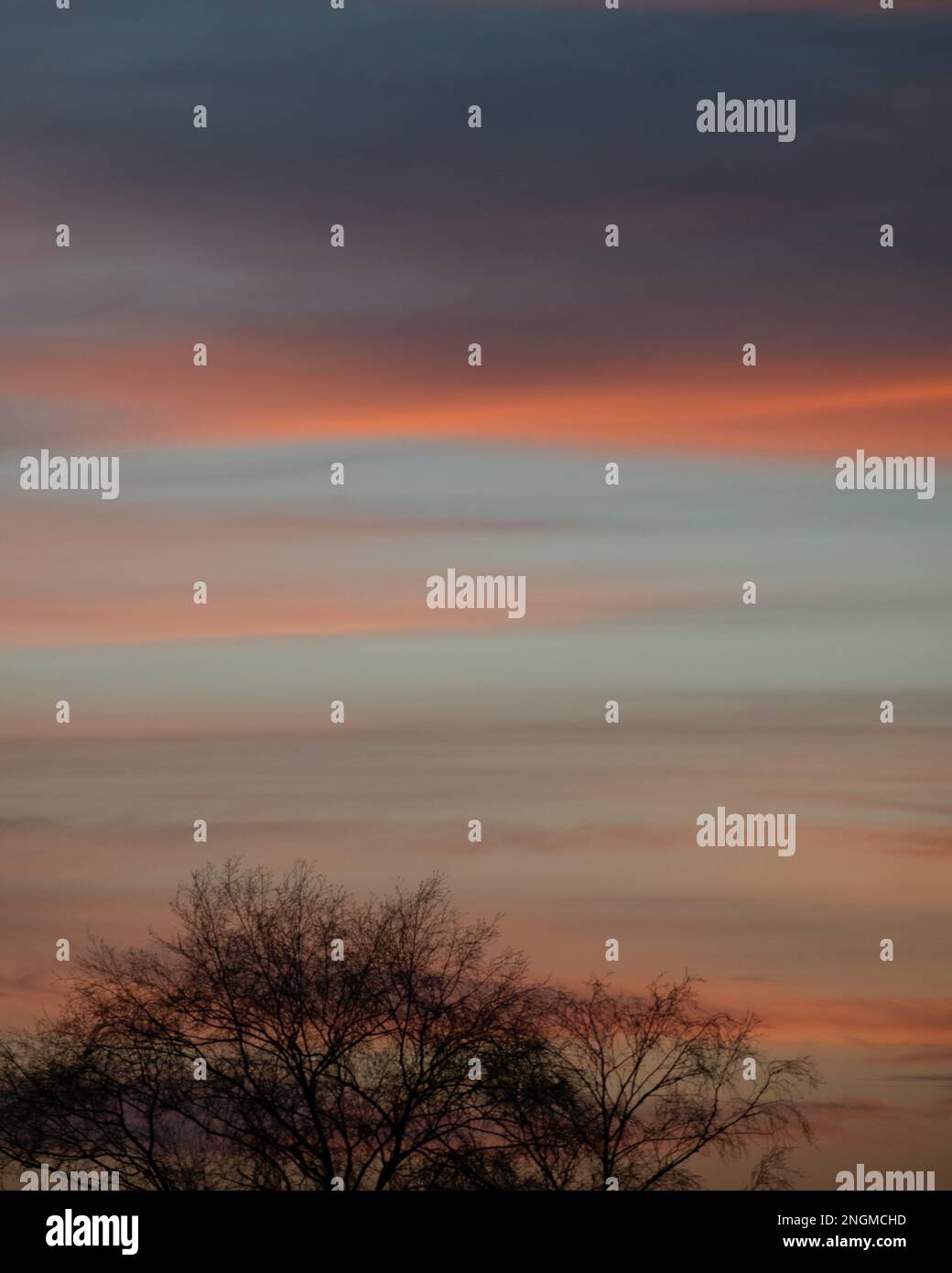 Muted orange and teal pastel sky with copy space Stock Photo