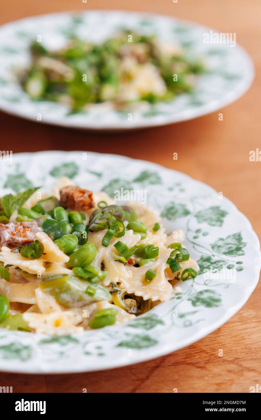 Spring meal with fresh fava beans, green asparagus, bow tie pasta and