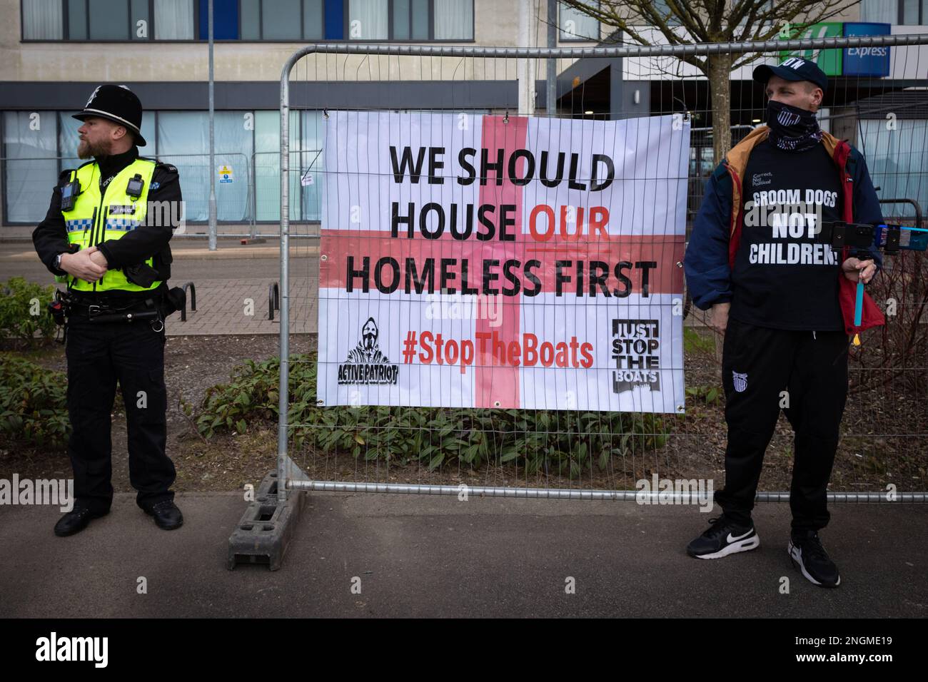 Rotherham, UK. 18th Feb, 2023. An antiimmigration demonstrator stands