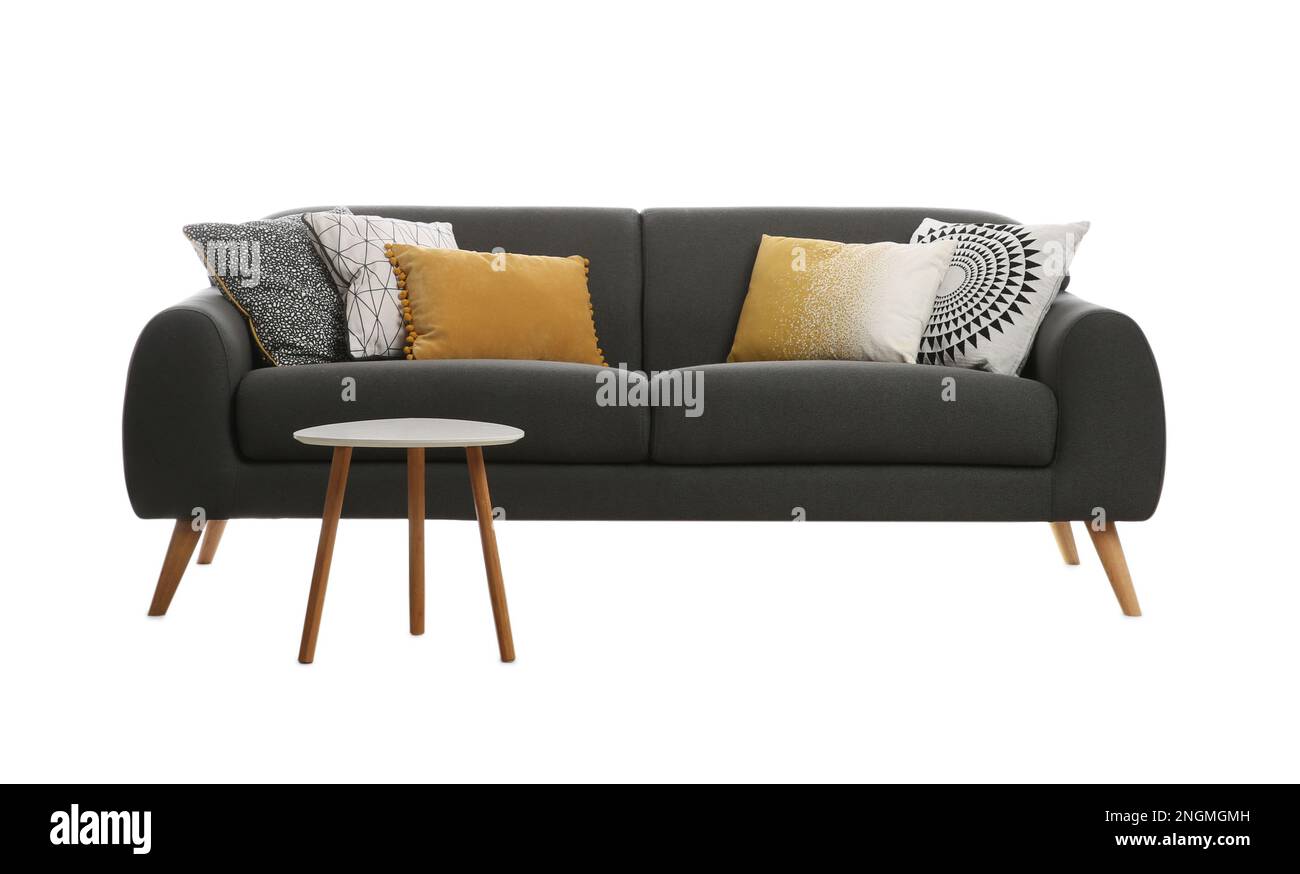 Comfortable grey sofa with cushions and table on white background