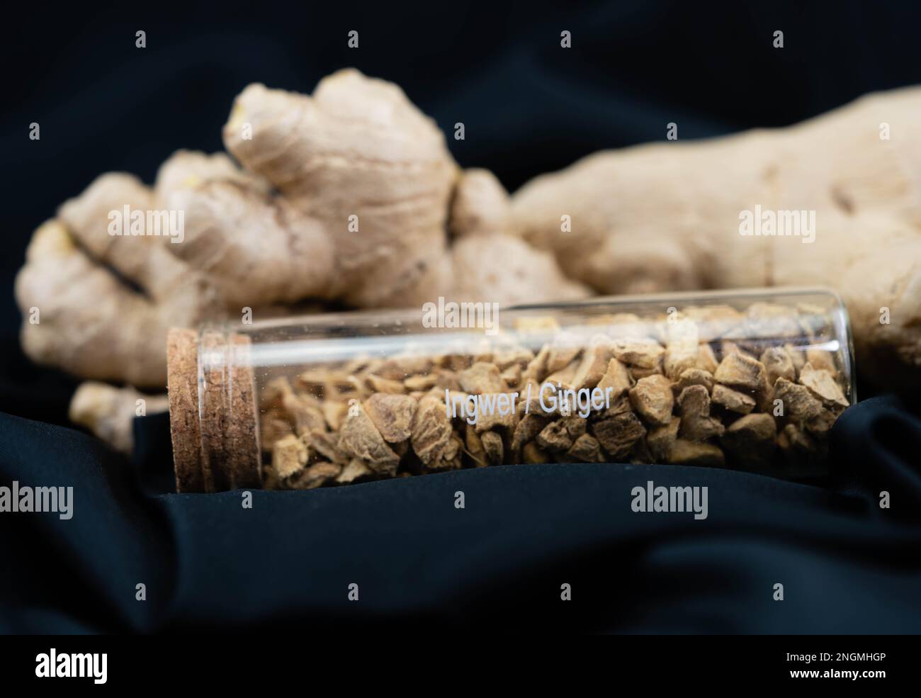 fresh ginger and dried ginger powder on olive wood Stock Photo