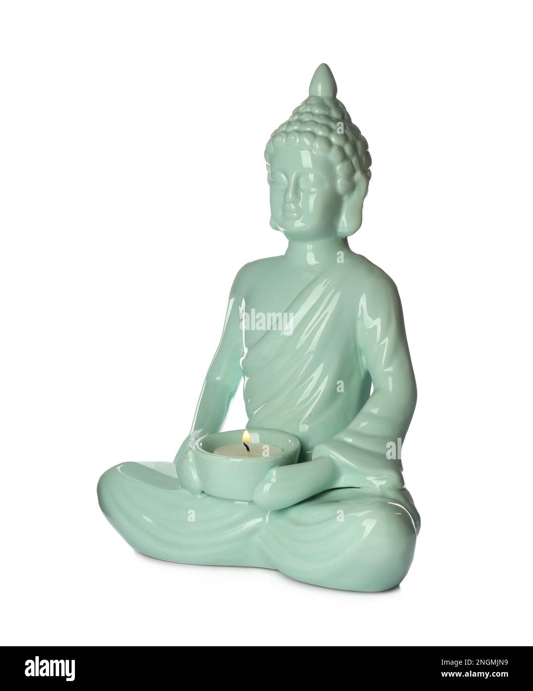 Beautiful ceramic Buddha sculpture with burning candle isolated on