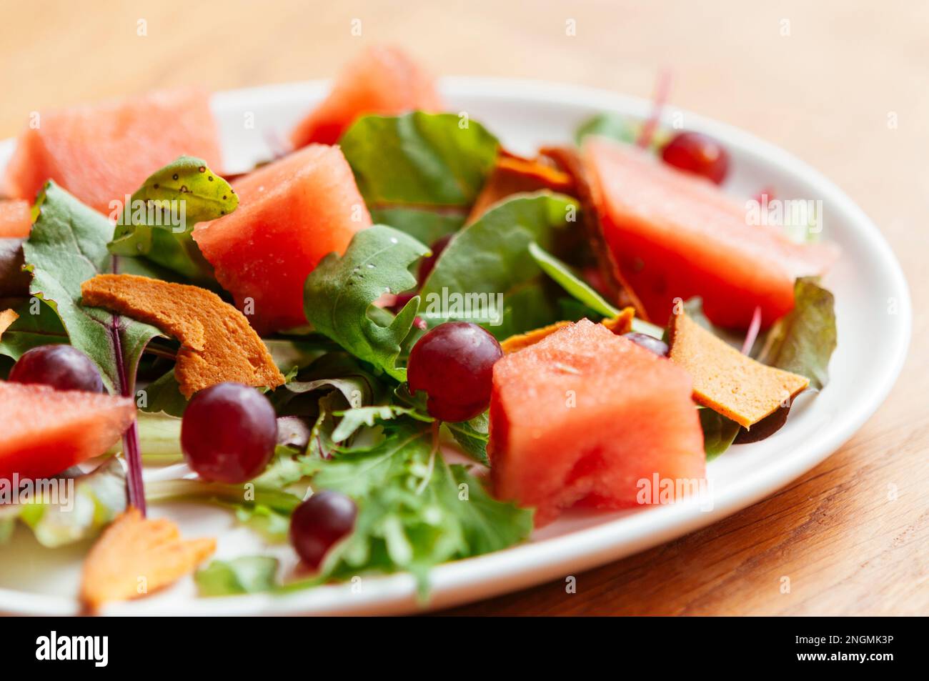 Mixed Salad wih Watermelon, Grapes and Vegan  Bologna Stock Photo