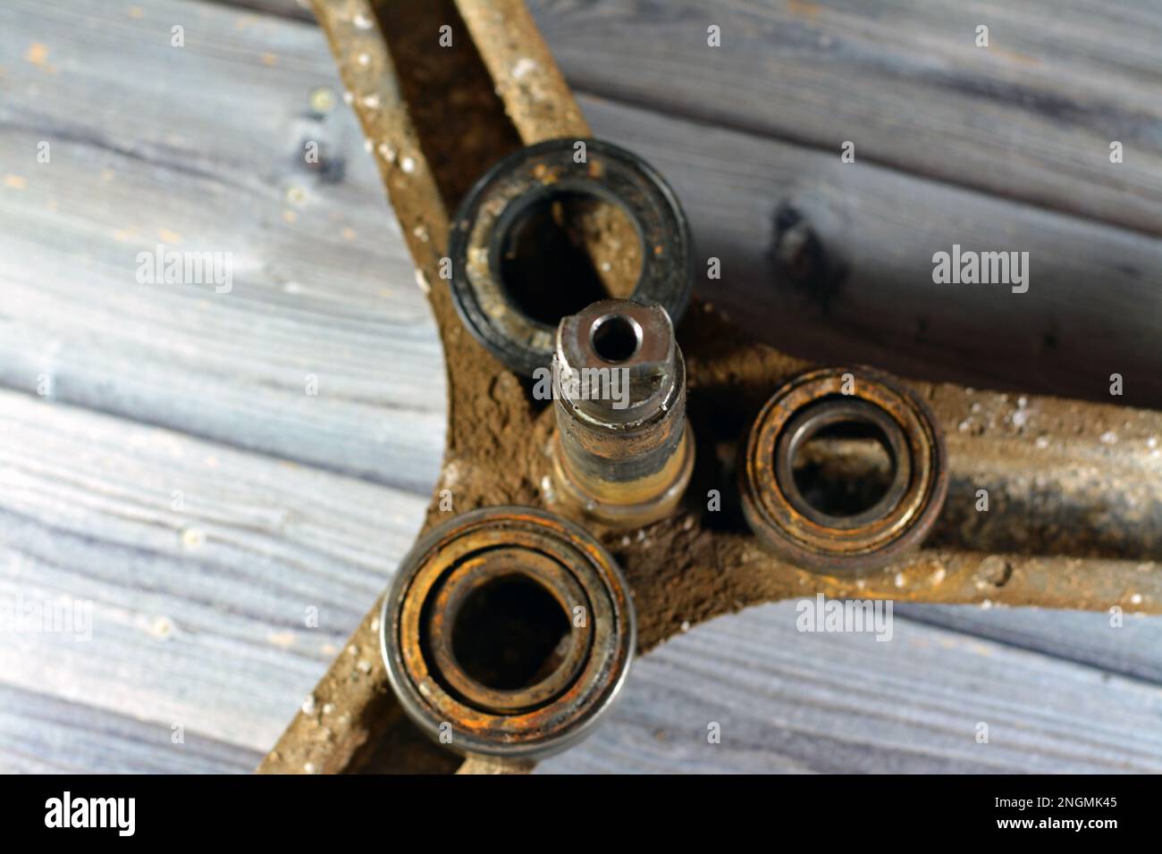 Rusty old dirty automatic electric washing machine drum spider and ball