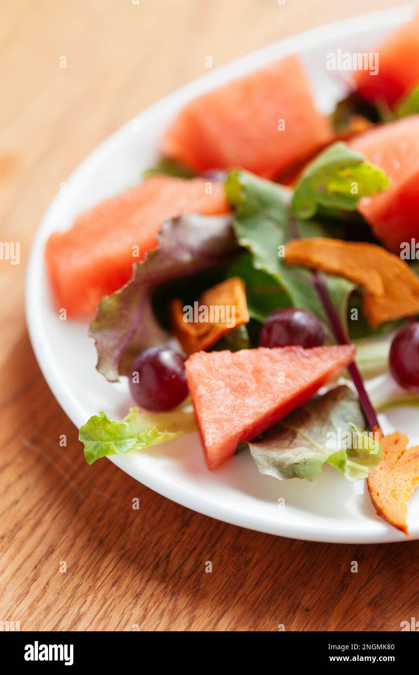 Mixed Salad wih Watermelon, Grapes and Vegan  Bologna Stock Photo