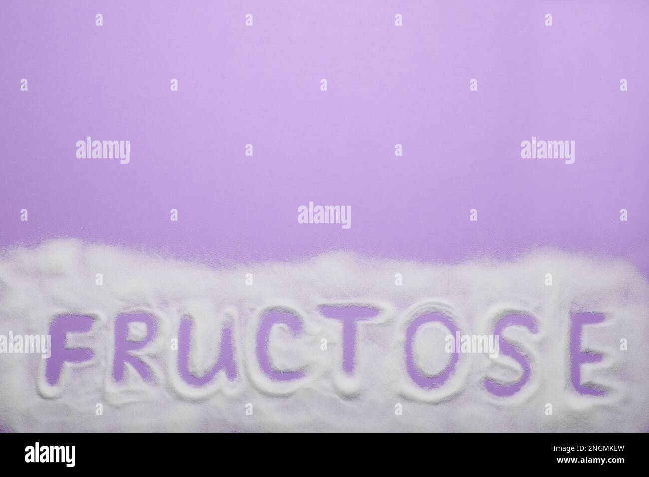 Fructose Lettering Word Fructose made of sugar on violet background, top view. Space for ...