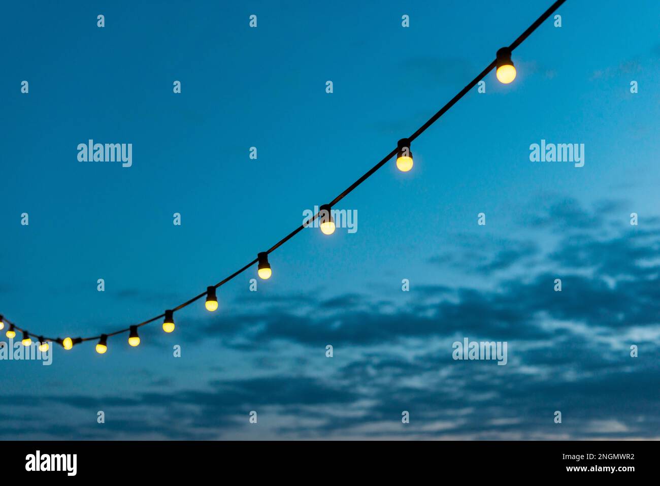 string lights sunset sky. High resolution photo Stock Photo Alamy