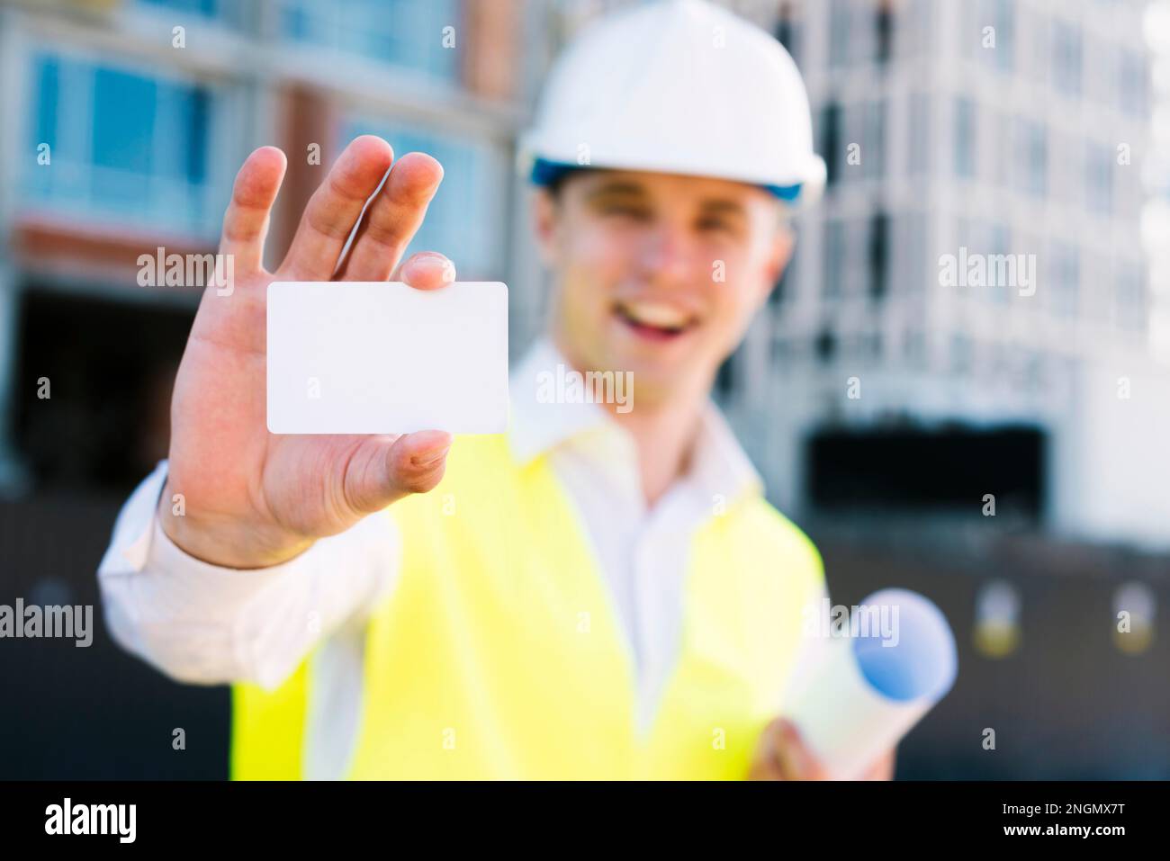 medium shot smiley man with business card Stock Photo