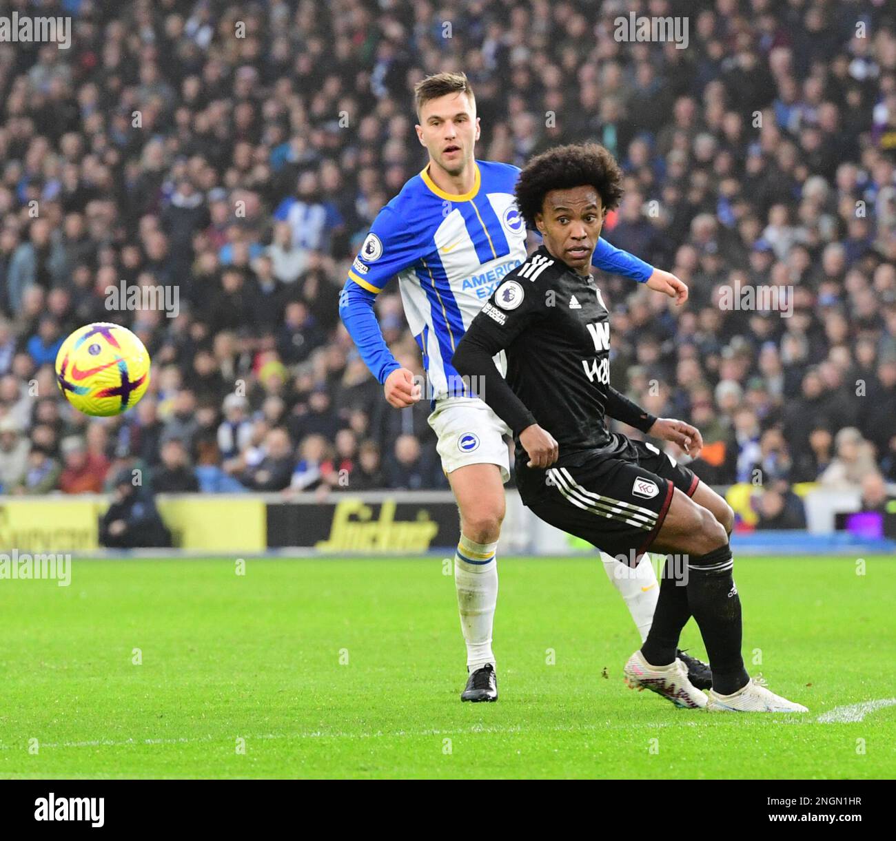 Brighton, UK. 18th Feb, 2023. Joel Veltman of Brighton and Hove Albion and Willian Borges Da Silva of Fulham FC during the Premier League match between Brighton & Hove Albion and Fulham at The Amex on February 18th 2023 in Brighton, England. (Photo by Jeff Mood/phcimages.com) Credit: PHC Images/Alamy Live News Stock Photo