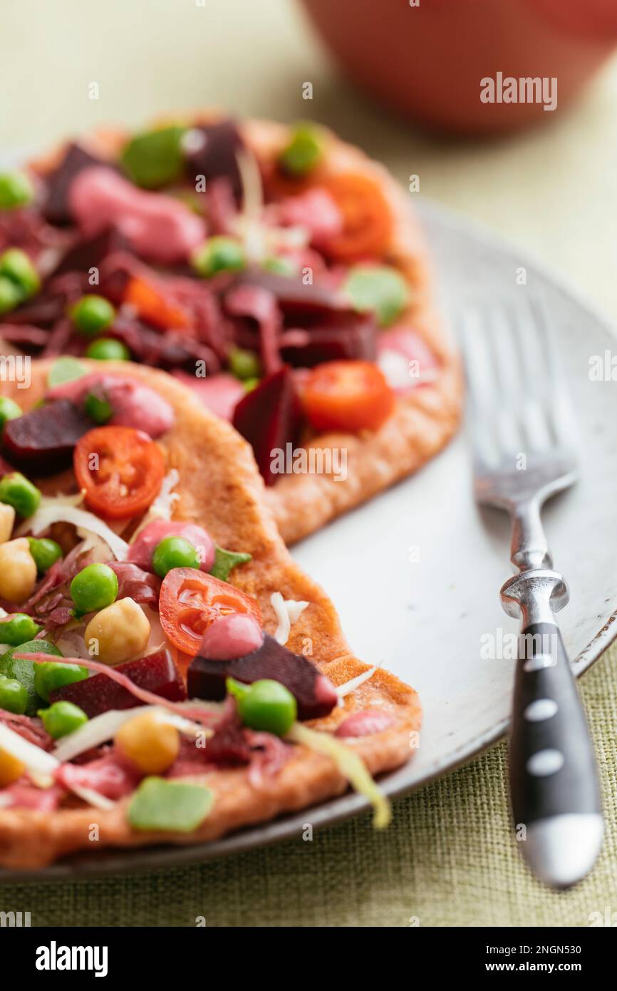 Homemade beet flatbreads with vegetables. Stock Photo