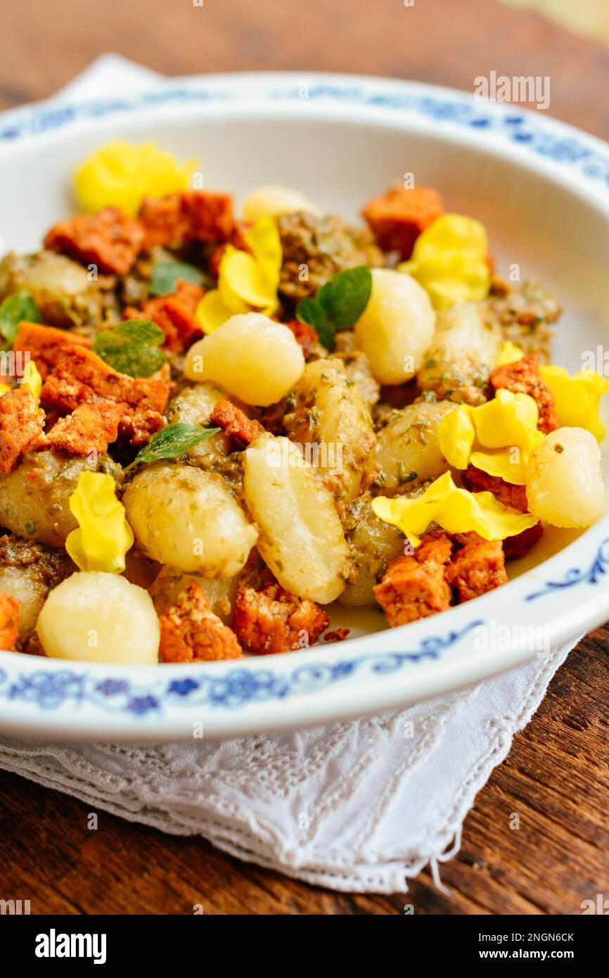 Gnocchi with Chickweed (Stellaria media) Pesto and Spicy Tofu Pieces. Garnished with mullein