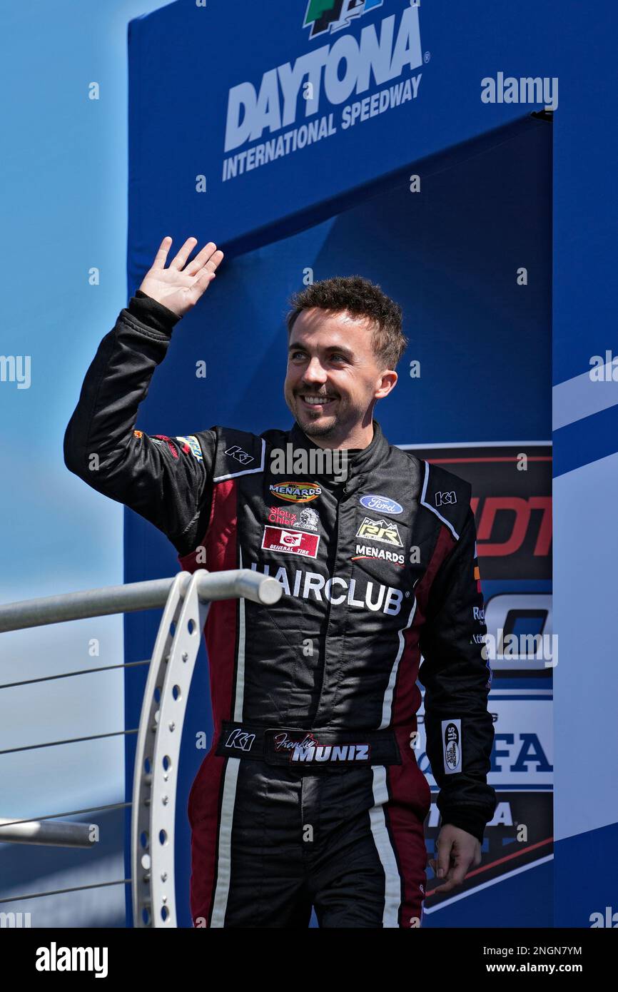 Actor turned race car driver Frankie Muniz waves to the crowd during