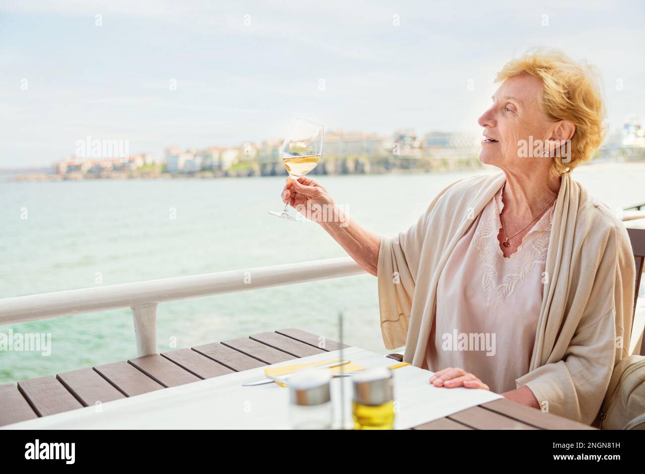 Mature woman alone wine happy hi-res stock photography and images - Alamy