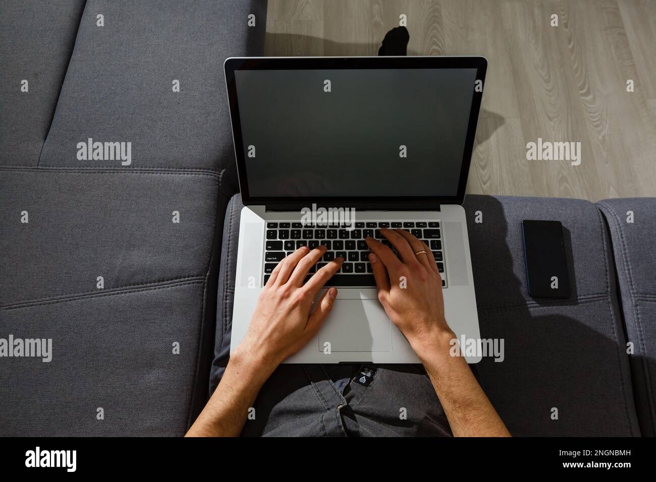 elegant business multitasking multimedia man using devices at home Stock Photo