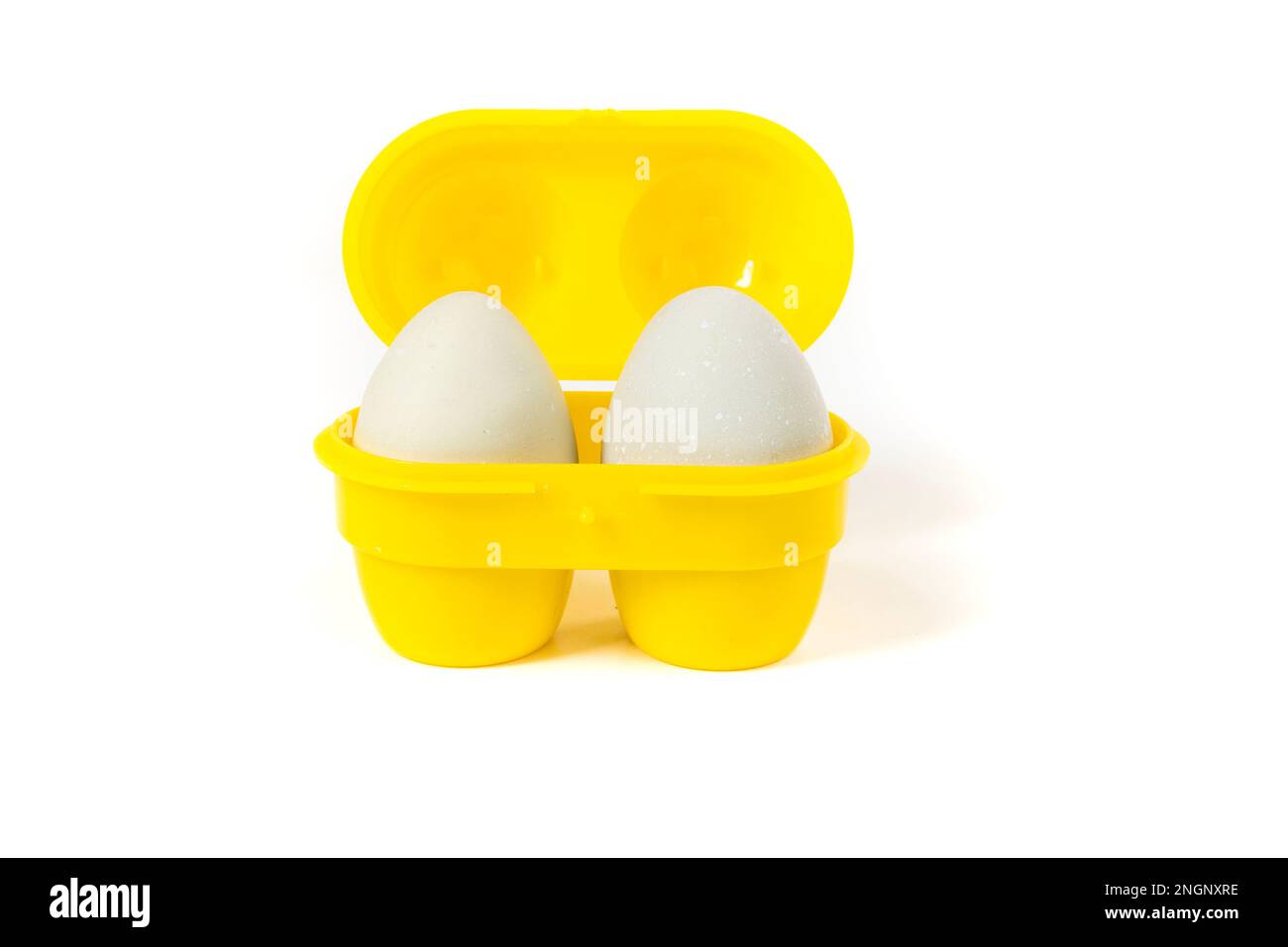 Green farm fresh eggs in a small yellow camping container Stock Photo Alamy