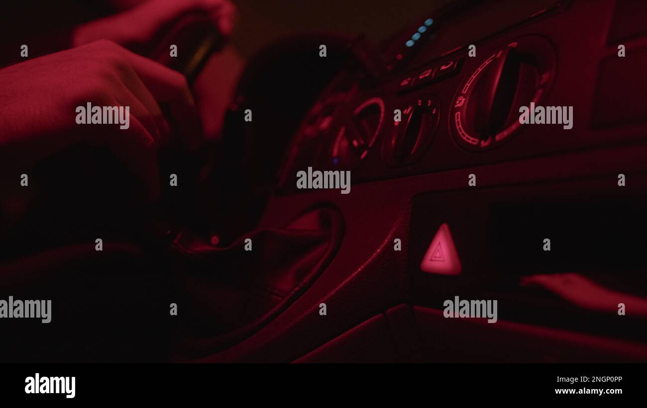 CloseUp of Male Driver's Hand Pushing the Flashing Hazard Lights